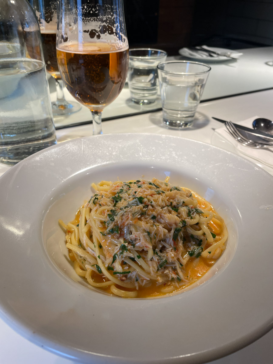 A plate of seafood pasta crab linguine.