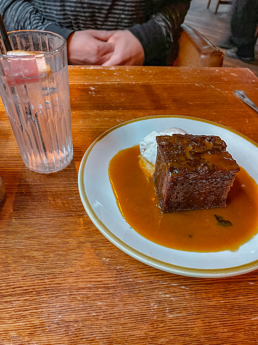 Sticky toffee pudding on a plate.