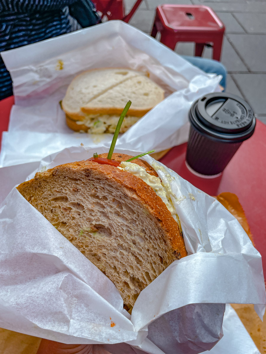 Serving of sandwiches and a cup of hot chocolate.