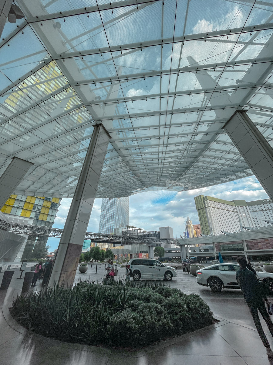 Cars and people at the valet driveway of Aria Las Vegas.